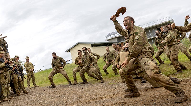 New Zealand Army soldiers from 2nd/4th Battalion, Royal New Zealand Infantry Regiment, led by Platoon Commander Lieutenant Peter Havell, perform a haka to Australian soldiers from 5th Brigade during Exercise Waratah Run in Singleton, NSW. Photo by Corporal Jacob Joseph.