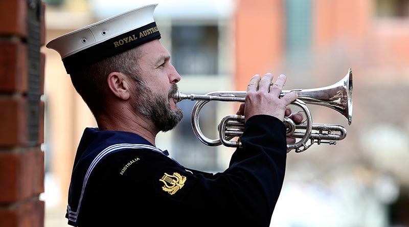 Then Leading Seaman Marcus Salone plays the Last Post during a memorial service at the Bathurst War Memorial in 2016. Photo by Able Seaman Nicolas Gonzalez.