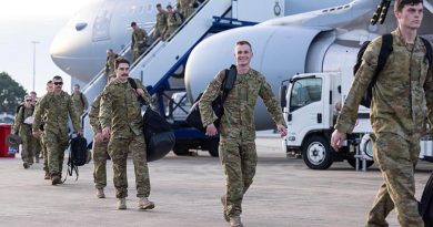 Lance Corporal Sam Kilgour, centre, disembarks a RAAF KC-30A Multi-Role Tanker Transport after his deployment on Operation Kudu. Photo by Corporal Jonathan Goedhart.