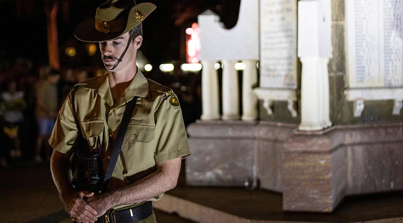 An Australian Army sapper from 3rd Combat Engineer Regiment stands at rest on arms reversed as a part of the catafalque party during the dawn service at ANZAC Park, Townsville, Queensland. Photo by Corporal Brandon Grey.