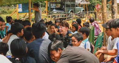 Royal Australian Navy officer Lieutenant Commander Alison Zilko speaks with school kids in the Philippines in her role as ADF Gender Advisor during Exercise Balikatan 2023.