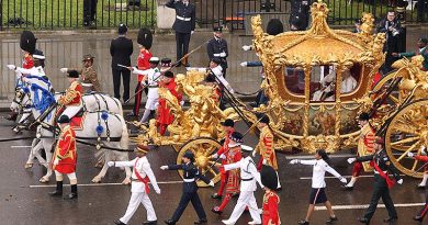 Their Majesties The King and Queen travel past Parliament Square in the Gold State Coach, flanked by 18 representatives of the Commonwealth, including Royal Australian Air Force Corporal Tegan Ross and Bombardier Michael Nona from Australia’s Federation Guard (second in line on both sides). Photo by AS1 Ryan Murray RAF. UK MOD © Crown copyright 2023.