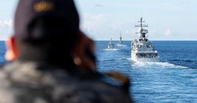 HMAS Anzac's Lieutenant Christopher Colalillo takes ranges during Officer of the Watch Manoeuvres with Republic of Singapore Navy RSS Vigliance (centre) Royal Malaysian Navy KD Lekir (right) and KD Gempita (left) during Exercise Bersama Shield 23. Photo by Leading Seaman Jarryd Capper.