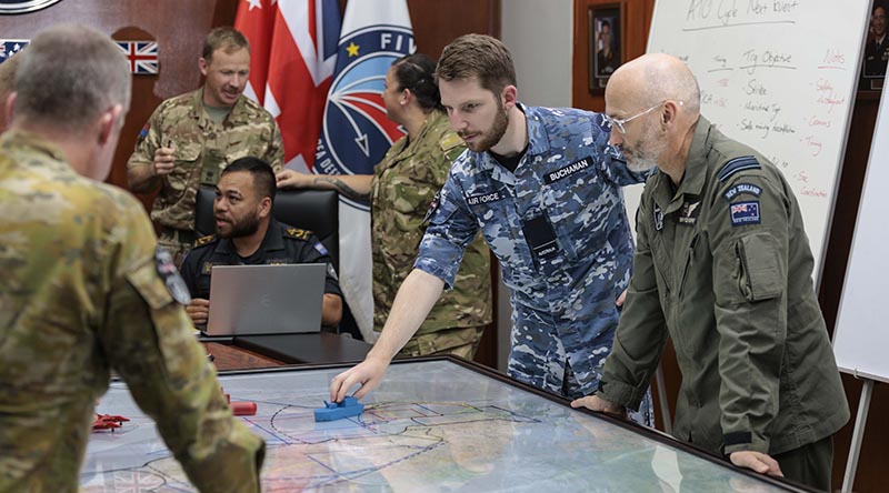 Royal Australian Air Force Flying Officer Jake Buchanan talks through training objectives during combined operations planning on Exercise Bersama Shield 2023 in Malaysia. Photo by Corporal Lisa Sherman.