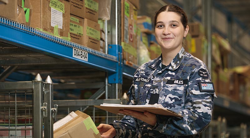 Aircraftwoman Indianna Biles checks the serial numbers of aircraft parts in the F-35A Lightning II warehouse at RAAF Base Williamtown, New South Wales. Photo by Leading Aircraftman Samuel Miller.