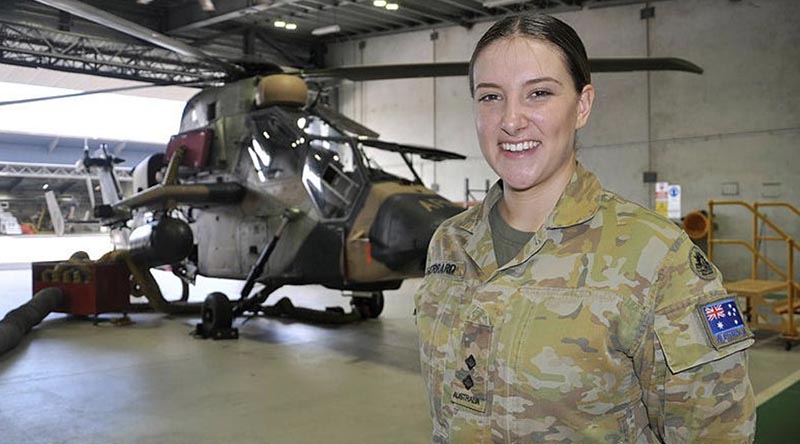Lieutenant Catherine Gerrard stands in front an ARH Tiger at 1st Aviation Regiment, Robertson Barracks, Darwin. Photo by Flight Lieutenant Nicholas O’Connor.