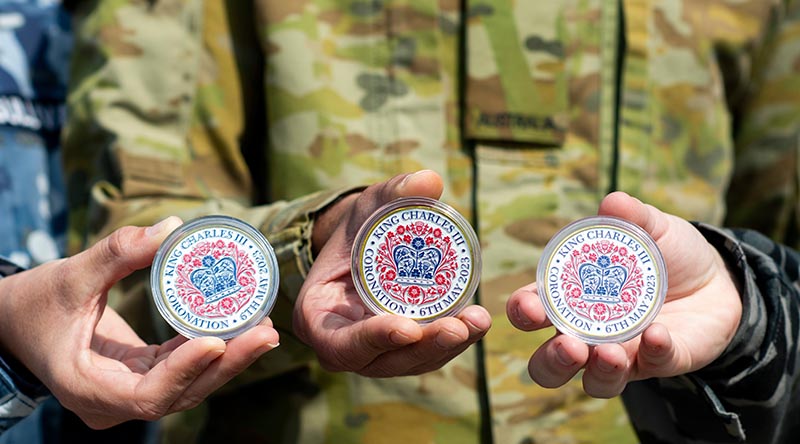 Australian personnel (and their Commonwealth counterparts) were presented with a military coin to commemorate their participation in the Coronation of His Majesty The King, at Army Training Centre Pirbight, UK. Photo by Leading Aircraftwoman Emma Schwenke.