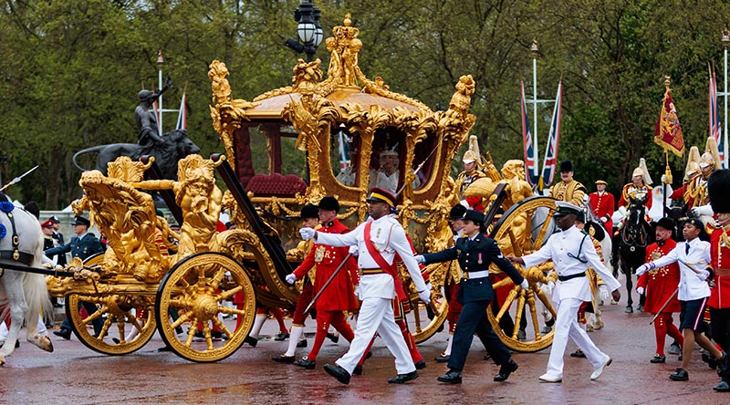 Royal Australian Air Force Corporal Tegan Ross from Australia's Federation Guard with representatives from Commonwealth countries escort the Gold State Coach during the Procession following the Coronation of King Charles III. Photo by Sergeant Andrew Sleeman.