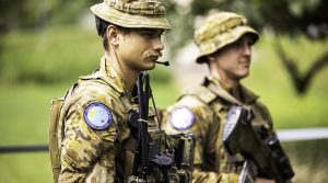 Australian Army Corporal Tyalr Markham, 6RAR, stands guard at an evacuee management centre during Exercise Croix Du Sud 2023 in New Caledonia. Photo by Corporal Dustin Anderson.