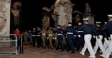 Australia's Federation Guard members march with the Commonwealth contingent into Buckingham Palace gardens during a night rehearsal for the King's Coronation. Photo by Sergeant Andrew Sleeman.