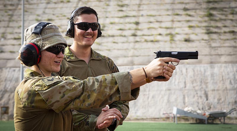 Australian Army Captain David Box instructs range-practice drills with Royal Australian Air Force Corporal Jessica Edwards during Operation Accordion at Australia’s operating base in the Middle East Region. Photo by Corporal Melina Young.