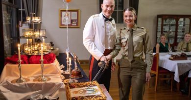 Lieutenant Colonel Anthony Craig and Private Paris Plate cut the birthday cake at the celebration of the Royal Australian Army Dental Corps' 80th anniversary. Photographer unknown. Cake, lost when photo cropped to fit formatting, digitally replaced in photo by CONTACT.
