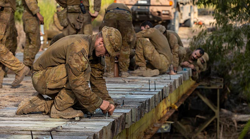 Australian Army sappers from the 2nd Combat Engineer Regiment prepare Elanora Bridge for demolition with high explosive during Exercise Terrier Walk at Shoalwater Bay Training Area, Queensland. Photo by Corporl Nicole Dorrett.