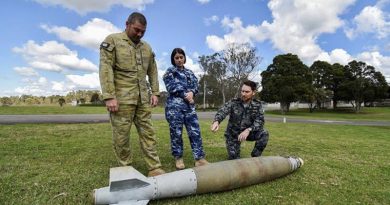 Combat engineer Sergeant Kieron Day, armament technician Corporal Bethany Magner and clearance diver Chief Petty Officer Ben Beck discuss unexploded ordnance. Photo by Corporal Randall Costello