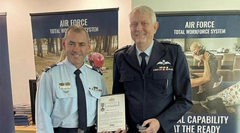 Air Commodore James Badgery – Chief of Staff Air Force HQ, left, presents Wing Commander Glendan Krause with his second Federation Star, marking 45 years of continuous service in the RAAF.