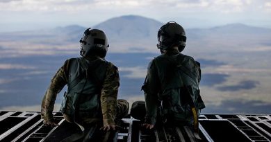 Royal Australian Air Force and United States Air Force loadmasters sit on the ramp of a No. 36 Squadron C-17A Globemaster III during a low-level navigation sortie in north Queensland during Exercise Global Dexterity 23-1. Photo by Corporal Kieren Whiteley.