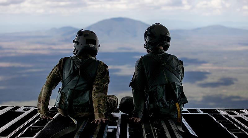 Royal Australian Air Force and United States Air Force loadmasters sit on the ramp of a No. 36 Squadron C-17A Globemaster III during a low-level navigation sortie in north Queensland during Exercise Global Dexterity 23-1. Photo by Corporal Kieren Whiteley.