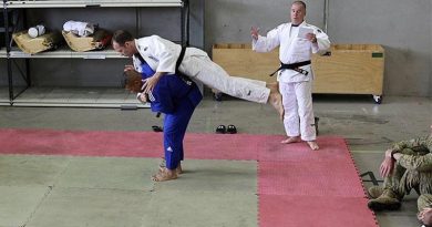 Private Feao Faka’Osi, in blue, demonstrates one of his favourite techniques, called ippon seoinage, on Lieutenant Colonel Morgan McCarthy during a judo demonstration.