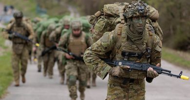 An Australian Army soldier deployed on Operation Kudu leads recruits from the Armed Forces of Ukraine as they march to a field training area in southern England. Photo by Sergeant Andrew Sleeman.