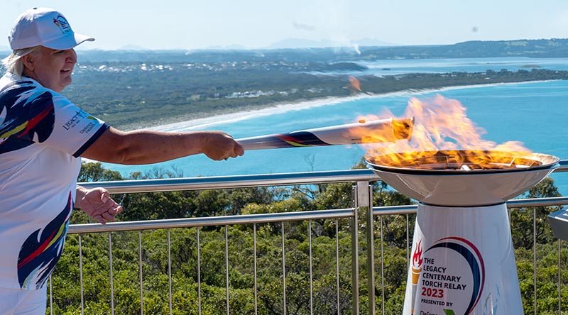 The flame is lit by a torch bearer as the Legacy Centenary Torch Relay begins in Albany, Western Australia, to begin its six-month journey across Australia. Photo by Private Reece Oakes.