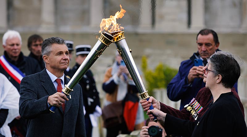 Assistant Minister for Veterans’ Affairs Matt Thistlethwaite lights a legacy torch during the launch of the Legacy Centenary Torch Relay at Pozieres British Cemetery, France. Photo by Sergeant Oliver Carter.