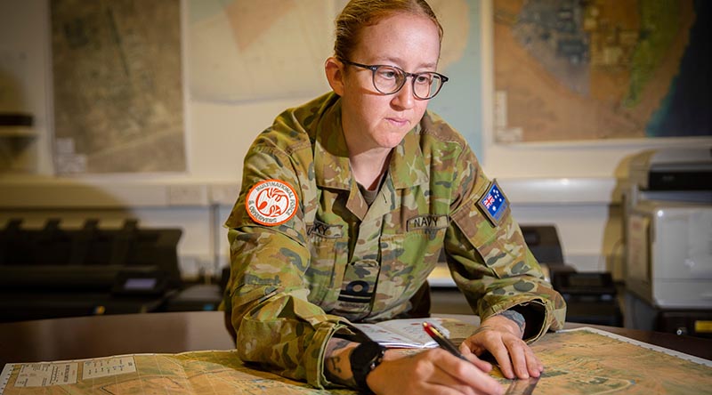 Lieutenant Sarah Lucinsky conducts a route plan on Operation Mazurka. Photo by Corporal Melina Young.
