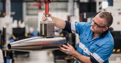 A worker on the production line examines a freshly forged 155mm artillery-shell casing at the Rheinmetall NIOA Munitions factory in Maryborough, Queensland. Photo supplied.