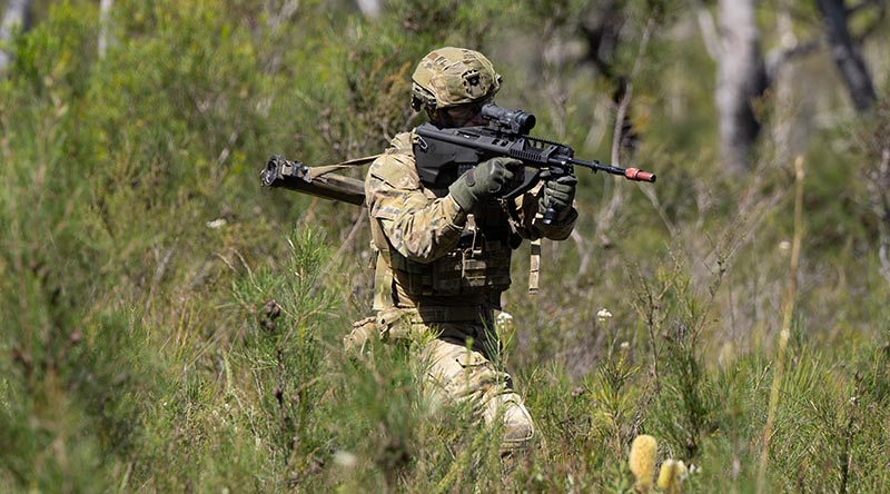 Australian Army solider Private Liam Brown from the 9th Battalion, Royal Queensland Regiment, takes a bound forward during a platoon attack on Exercise Robey at the Wide Bay Training Area. Photo by Private Connor Morrison.