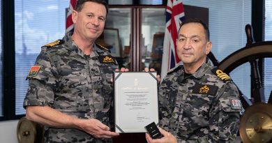 Chief of Navy Vice Admiral Mark Hammond presents a Federation Star to Commander Bertram Slape, marking 50 years’ service in the Royal Australian Navy. Photo by Petty Officer Christopher Szumlanski.