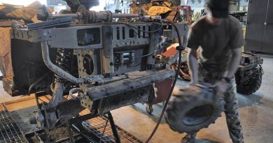 A vehicle mechanic from the Special Operations Task Group’s (SOTG’s) Combat Service Support Team (CSST) undertakes repairs on an all-terrain vehicle required by special-forces soldiers. Photo by Lieutenant Aaron Oldaker.
