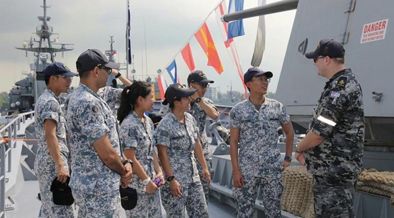 Leading Seaman Cory Duggan gives a tour to Singapore Navy personnel on board HMAS Toowoomba. Photos: Able Seaman Ashlee Ritz.