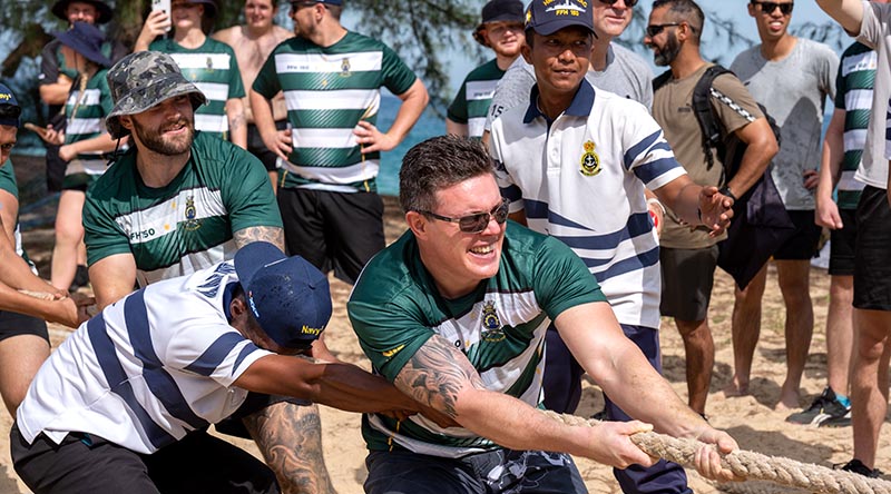Personnel from HMAS Anzac and Royal Malaysian Navy KD Gempita compete in the tug-of-war against other Exercise Bersama Shield 2023 participants as part of a sports day on Tioman Island, Malaysia. Photo by Leading Seaman.