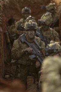 Private Tyson Woods, 3RAR, listens to direction during an assault. Photo by Lance Corporal Riley Blennerhassett.