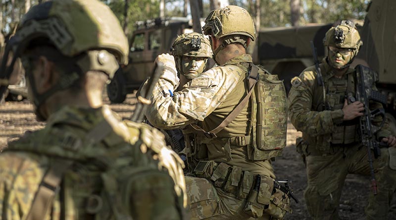 Australian Army soldiers from Combat Team Viper discuss tactics during Exercise Viper Strike at Gallipoli Barracks, Enoggera. Photo by Captain Cody Tsaousis.
