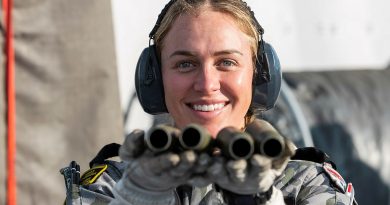 Leading Seaman Esther Melvin holds 25mm Typhoon shells following a live-fire activity on HMAS Canberra as the ship makes its way to Exercise Talismans Sabre in 2021. Story by Private Nicholas Marquis. Photo by Leading Seaman Sittichai Sakonpoonpol.