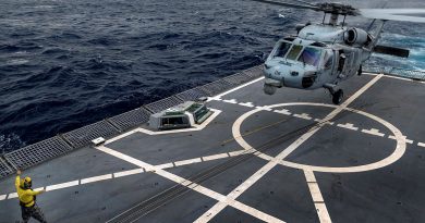 USS America's MH-60S helicopter is marshalled by HMAS Anzac’s Leading Seaman Joshua Leach during deck landing training on board Anzac. Story by Lieutenant Max Logan. All photos by Leading Seaman Jarryd Capper.
