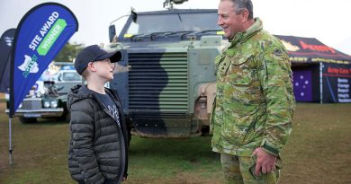 Lieutenant Oliver Breeze of 2nd Force Support Battalion chats with Austin outside the Army display at Agfest in Tasmania. Story by Major Tim Sydenham.
