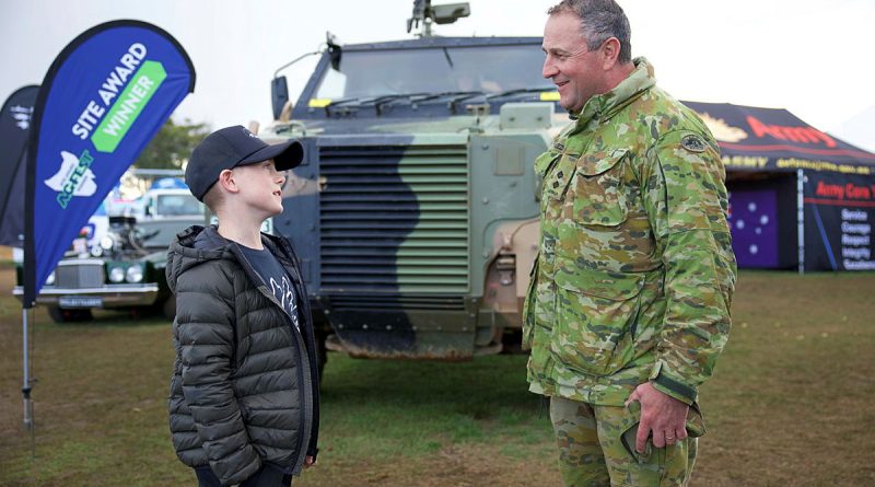 Lieutenant Oliver Breeze of 2nd Force Support Battalion chats with Austin outside the Army display at Agfest in Tasmania. Story by Major Tim Sydenham.