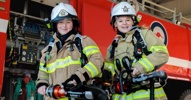 Air Force Aviation Programs for Women participants try on firefighting equipment at RAAF Base Williamtown. Story by Flight Lieutenant Jessica Winnall. Photo by Leading Aircraftman Samuel Miller.