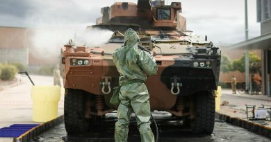 Australian Army sappers from the 2nd Combat Engineer Regiment hose down a Boxer combat reconnaissance vehicle in a decontamination bay. Story by Captain Cody Tsaousis. Photo by Sapper Tristan Montagu.