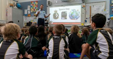 Flight Sergeant Daniel Hickey from Surveillance and Control Training Unit, educates the Kindergarten students about space. Story by Squadron Leader Bettina Mears. Photo by Leading Aircraftman Samuel Miller.