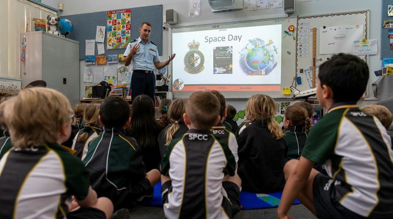 Flight Sergeant Daniel Hickey from Surveillance and Control Training Unit, educates the Kindergarten students about space. Story by Squadron Leader Bettina Mears. Photo by Leading Aircraftman Samuel Miller.