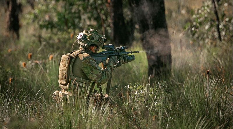 A rifleman from 8th/9th Battalion, The Royal Australian Regiment, engages a target with an EF88 Austeyr rifle during a platoon live-fire training serial a part of Exercise Cobra Run. Story by Captain Cody Tsaousis. Photo by Sapper Tristan Montagu.