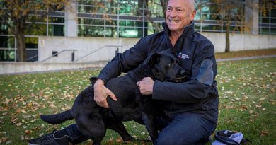 Michael Nobes, a former Navy clearance diver, and his assistance dog Lola outside Russell Offices, Canberra, for a fundraising and awareness barbeque to support Defence Community Dogs. Story and photo by Corporal Jacob Joseph.