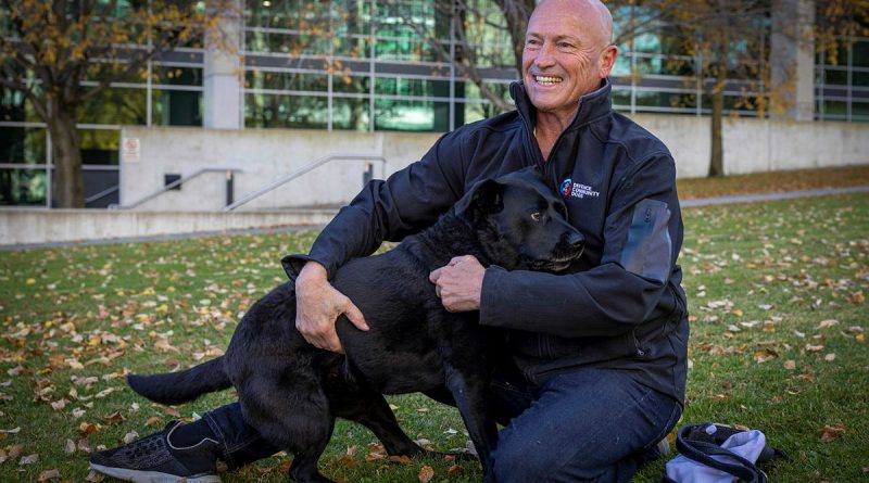Michael Nobes, a former Navy clearance diver, and his assistance dog Lola outside Russell Offices, Canberra, for a fundraising and awareness barbeque to support Defence Community Dogs. Story and photo by Corporal Jacob Joseph.