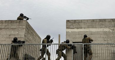 Soldiers from the 5th Brigade clear a building using airsoft rifles at Holsworthy Training Area at the end of Exercise Arras Sprint. Story by Major Jesse Robilliard. Photo by Private Sarah Fisher.