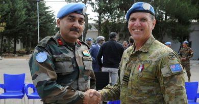 Wing Commander Stuart Wheal is congratulated by Deputy Force Commander Brigadier General Amitabh Jha (Indian Army) after receiving the UNDOF medal. Story by Major Carrie Robards. Photo by Major Shobit Bahadur Chand (Nepali Army).