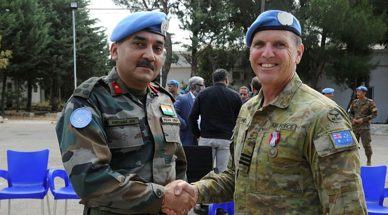 Wing Commander Stuart Wheal is congratulated by Deputy Force Commander Brigadier General Amitabh Jha (Indian Army) after receiving the UNDOF medal. Story by Major Carrie Robards. Photo by Major Shobit Bahadur Chand (Nepali Army).