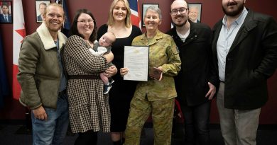 Warrant Officer Class Two Linda Lane, centre, with her family after being presented the Federation Star clasp to her Defence Long Service Medal for 40 years of service at Borneo Barracks in Cabarlah, Queensland. Story by Captain Evita Ryan. Photo by Warrant Officer Class Two Kim Allen.