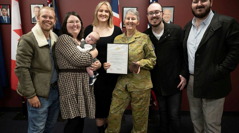 Warrant Officer Class Two Linda Lane, centre, with her family after being presented the Federation Star clasp to her Defence Long Service Medal for 40 years of service at Borneo Barracks in Cabarlah, Queensland. Story by Captain Evita Ryan. Photo by Warrant Officer Class Two Kim Allen.
